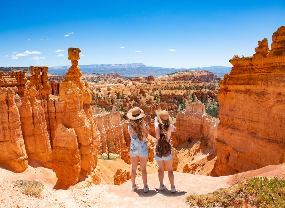Girls,On,Vacation,Hiking,Trip.,Friends,Standing,Next,To,Thor's bryce canyon usa