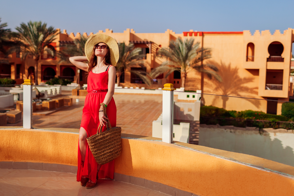 Happy,Young,Woman,Walking,On,Hotel,Territory.,Summer,Vacation,In turistka pred hotelom v egypte